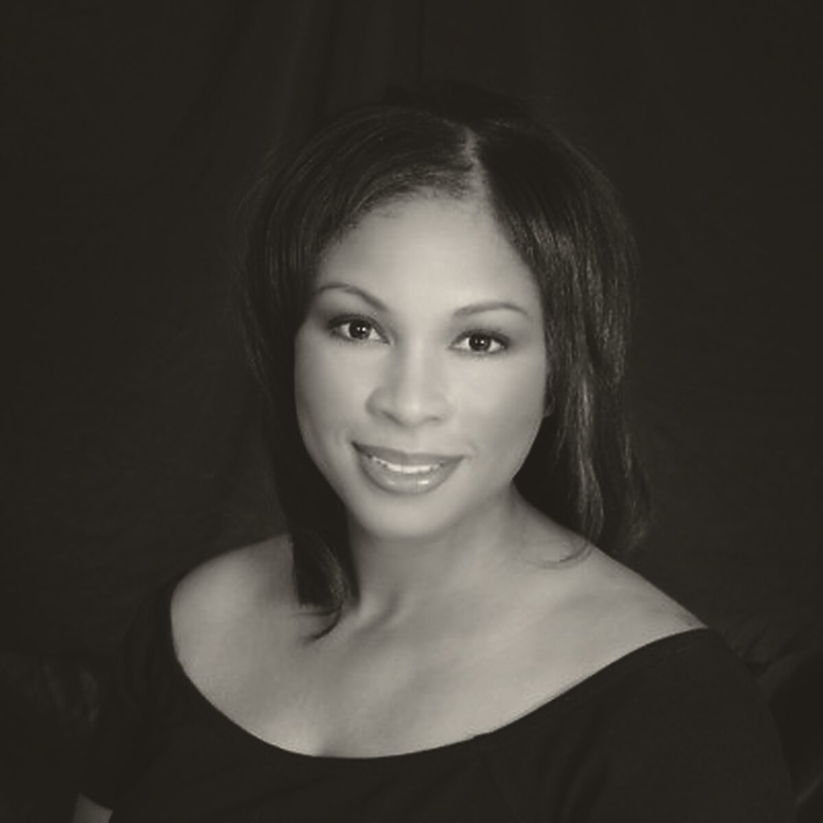 Portrait of a woman, standing in for a photograph of Regina Wilson.